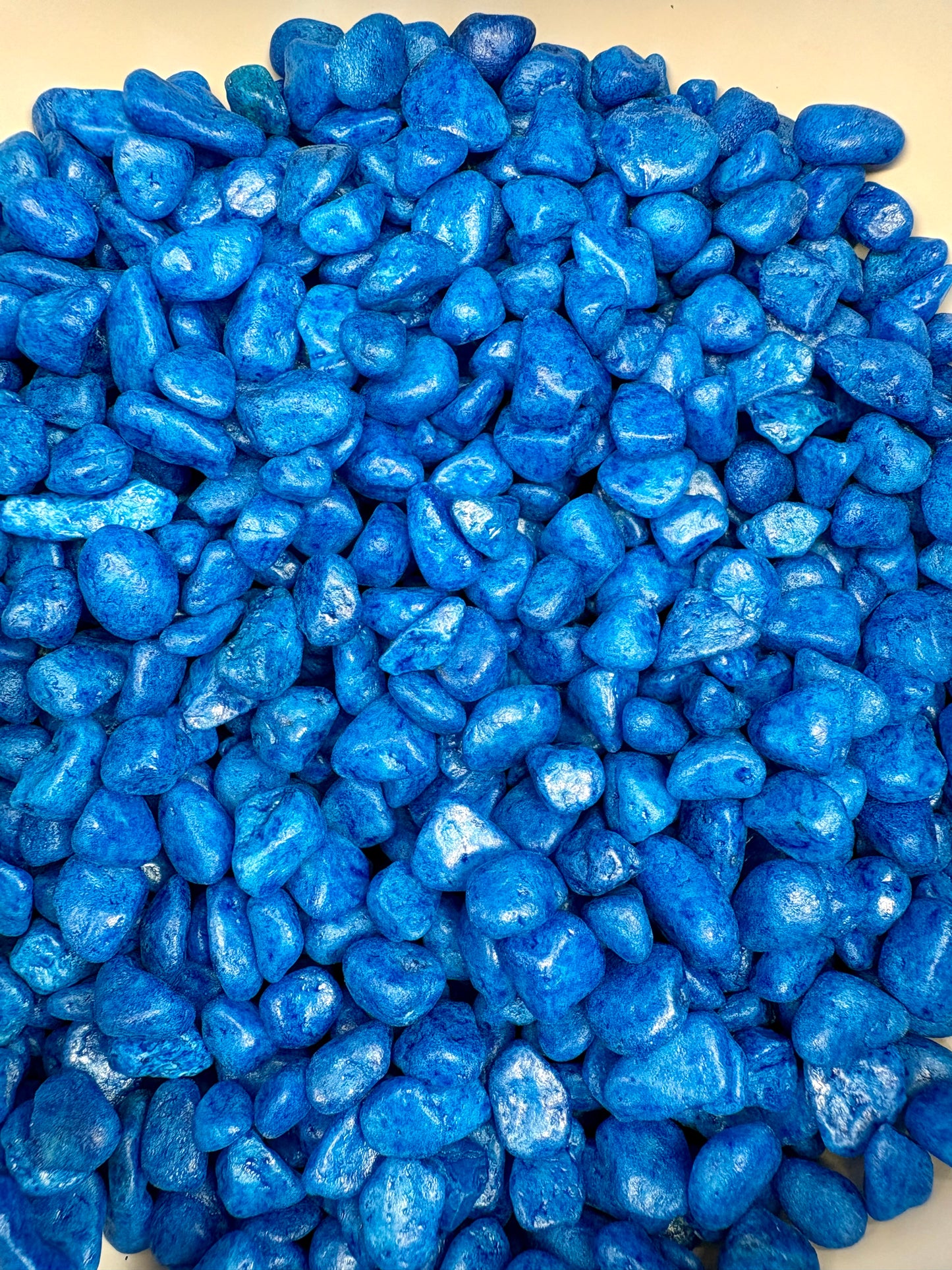 Blue pebbles on a white background