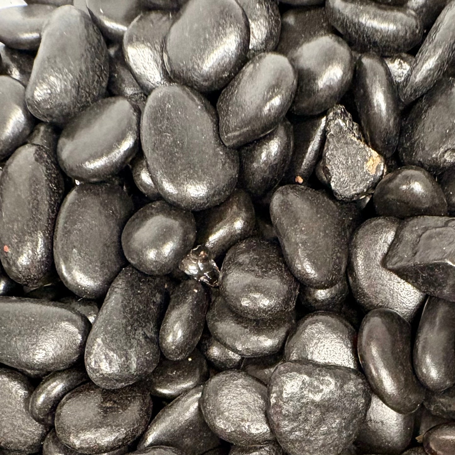Close-up of dark gray pebbles