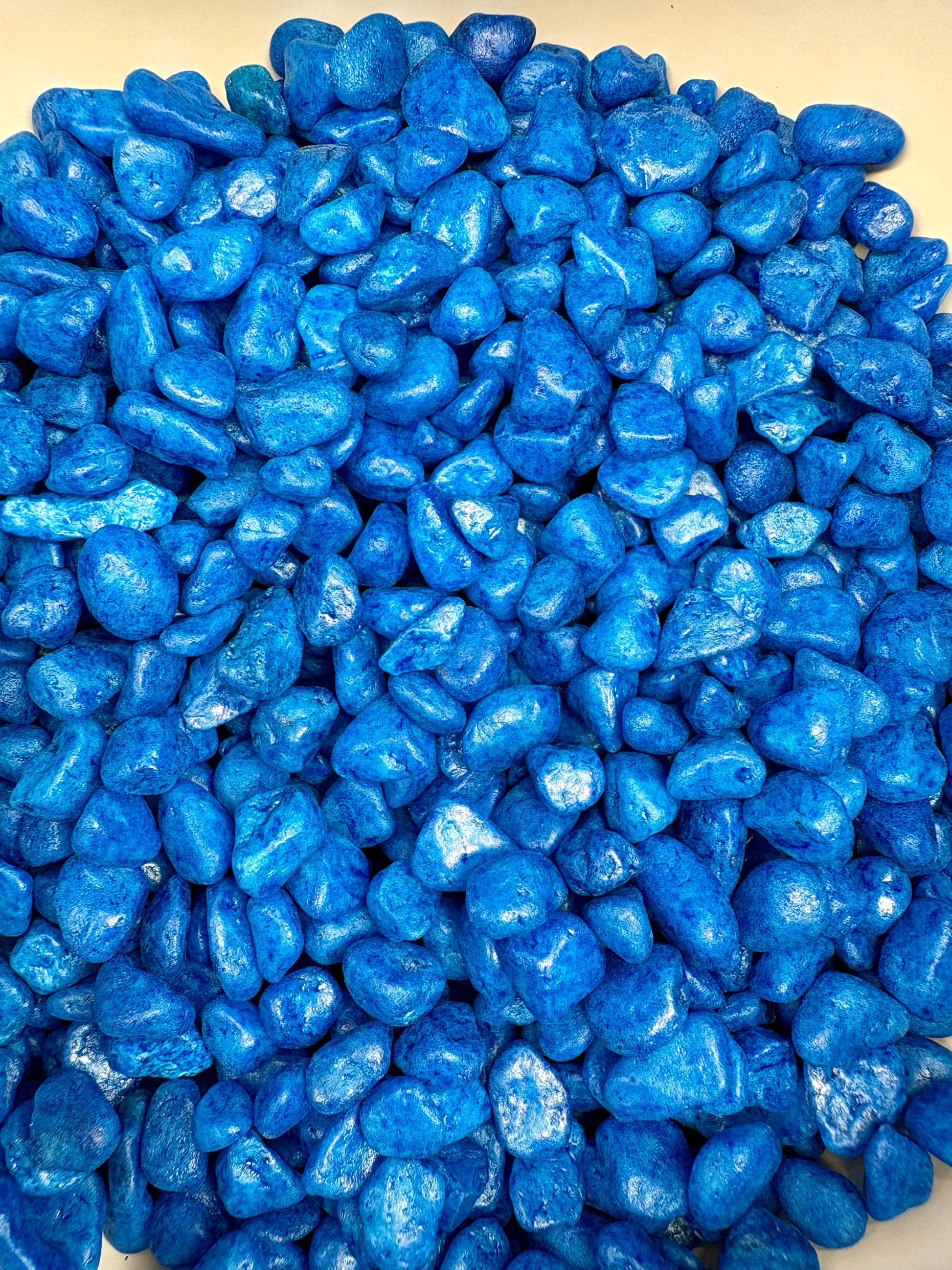 Blue pebbles on a white background