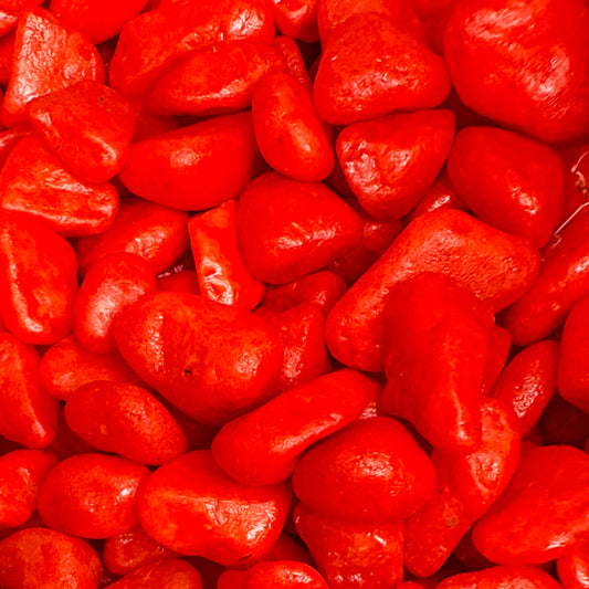 Close-up of bright red, textured stones.