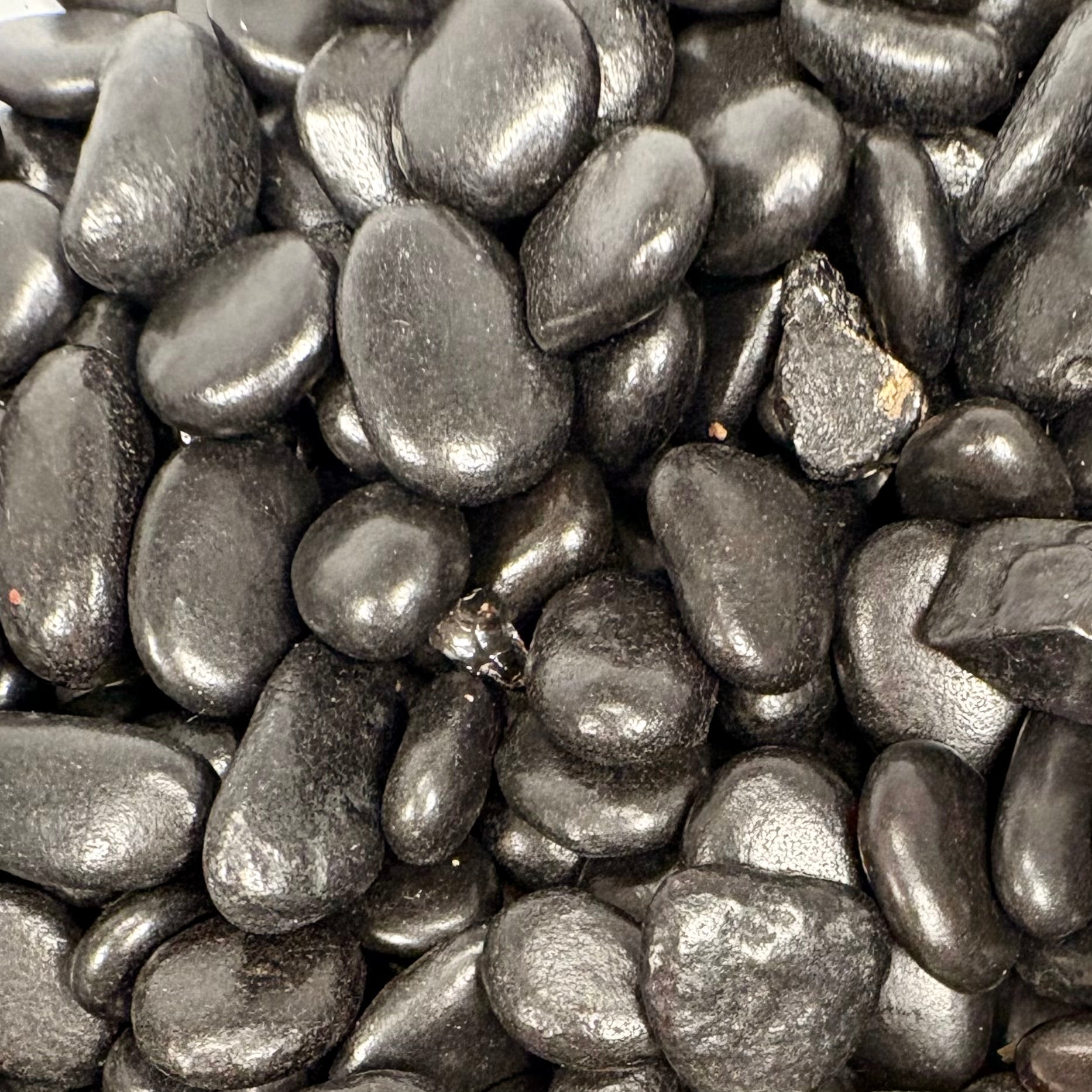 Close-up of dark gray pebbles