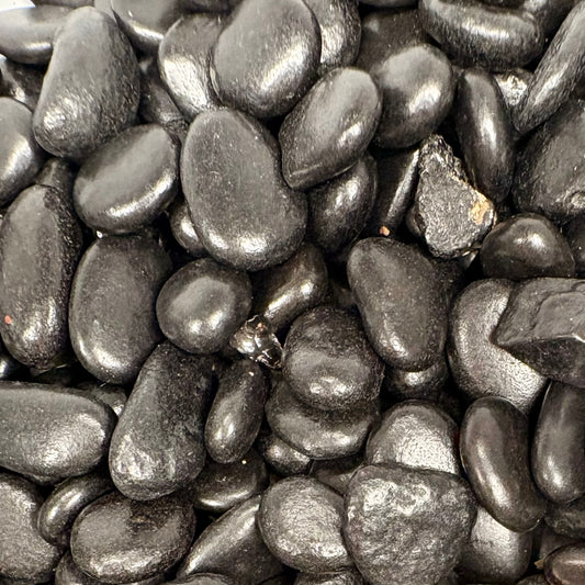 Close-up of dark gray pebbles
